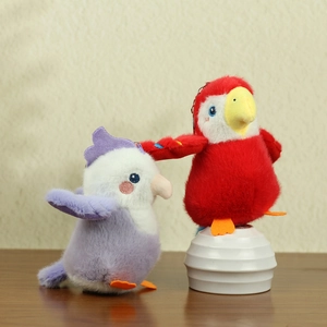 Macro detail of red and purple parrot plush keychains with fine embroidery and soft texture