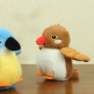 Close-up of a brown sparrow plush keychain with fine embroidery and metal ring hook