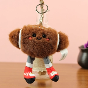 Porte-clés ballon de rugby en peluche avec visage mignon et chaussures rouges