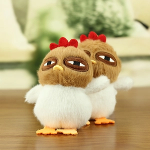 Close-up of cute plush chicken pendants with funny expressions and soft fur texture