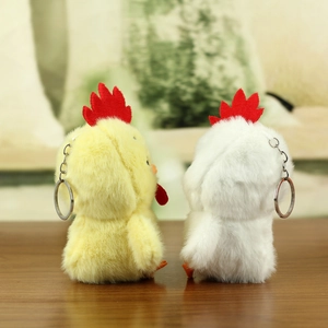 Detail view of plush chicken charms with soft texture and silver metal keychains