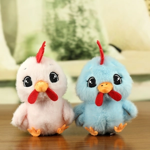 Detailed view of pink and blue plush chicken charms with soft fur and vibrant details