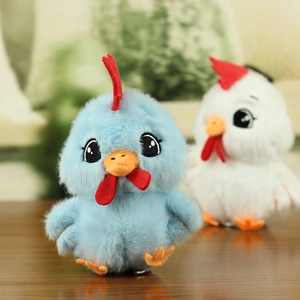 Close-up of cute plush chick pendants in blue and white with soft fluffy texture