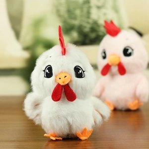 Close-up of a white plush chicken keychain with a red comb and embroidered eyes