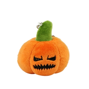 Funny Halloween pumpkin plush keychain with black embroidered face on orange soft fabric