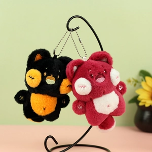 Cute plush cartoon bear keychains in black-orange and red-pink with soft fluffy texture