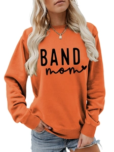 Detail of bright orange crewneck sweatshirt featuring black BAND mom heart graphic