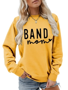 Detailed view of the ginger yellow sweatshirt featuring BAND mom print and ribbed collar