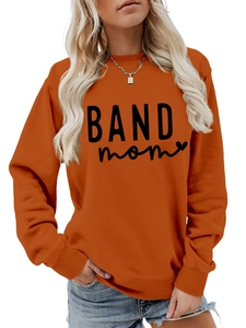Close-up of BAND mom art lettering and heart design on bright orange sweatshirt
