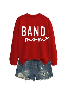 Flat lay of red long-sleeve sweatshirt with BAND mom print and blue denim shorts set