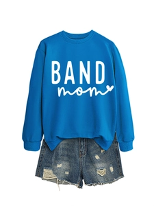 Flat lay of bright blue BAND mom sweatshirt and distressed denim shorts set