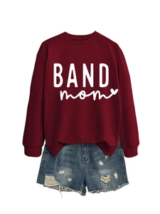 Detail of burgundy BAND mom sweatshirt with heart print and distressed denim shorts