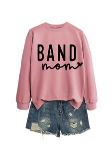 Detail of pink long sleeve sweatshirt featuring black BAND mom text and heart graphic