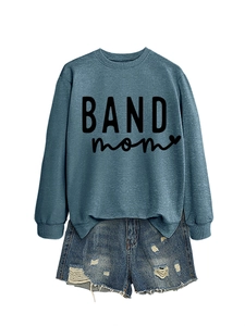 Detail of navy blue Band Mom sweatshirt paired with distressed denim shorts on white background