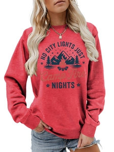 Detail of red crewneck sweatshirt with 'NO CITY LIGHTS JUST CAMP FIRE NIGHTS' print