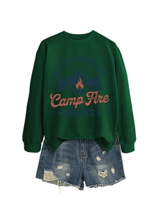 Detail of dark green cotton sweatshirt with campfire print and frayed denim shorts
