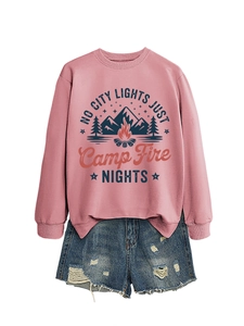 Detail of pink sweatshirt featuring mountain campfire graphic and retro typography