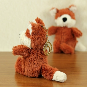 Cute brown plush fox keychain with soft fur and golden metal spring clip ring