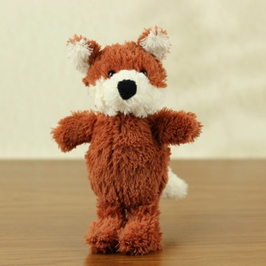 Detailed close-up of fluffy fox plush toy with orange fur and soft cream-white accents