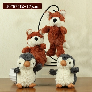 Detail view of plush penguin and fox toy set showing texture and 10x8x17cm dimensions