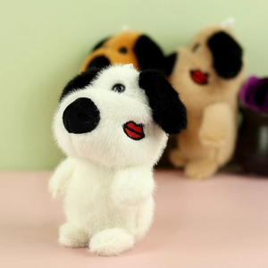 Detail of plush dog keychain with white fluffy fur and a red lip kiss embroidery