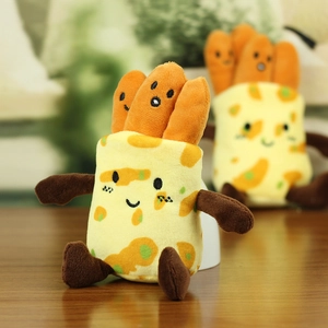 Macro shot of plush food pendant with cute faces and soft velvet texture detail