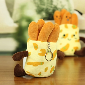 Macro shot of a creative plush French fries keychain with a metal ring and soft texture