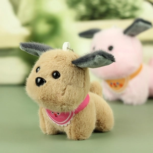 Close-up of cute plush dog keychains with colorful scarves and metal attachment rings