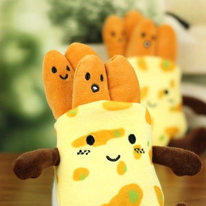 Close-up of plush food toy with cute facial expressions and soft yellow fabric texture
