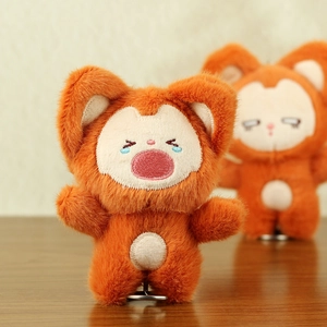 Close-up of cute orange fox plush doll with detailed facial embroidery and soft fur