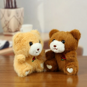 Cute plush teddy bear keychain pair with red rose embroidery on soft fluffy fabric