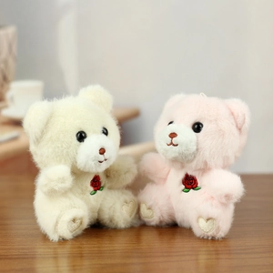 Detailed plush teddy bears featuring red rose embroidery and golden heart sequin patches