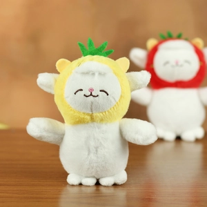 Close-up of cute plush sheep wearing a yellow pineapple hat with soft white fur texture