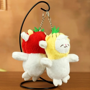 Detail of plush lamb keychains featuring cute strawberry and pineapple fruit hats