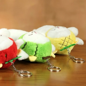 Close-up of cute plush sheep keychains with strawberry watermelon and pineapple hats