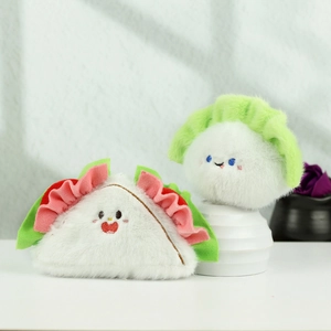Detail of cute plush food pendants featuring soft croissant and sushi character charms