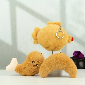 Detailed view of plush food keychains featuring tempura and croissant shapes with soft textures