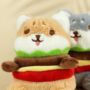 Detail of plush hamburger toy with Shiba Inu and Husky puppy faces and embroidered texture