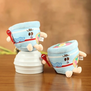 Detail of plush seafood noodle cup pendants with cute eyes and small red spoon accessory