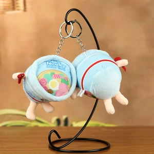 Detail of cute instant noodle plush charm with seafood flavor lid and metal keychain