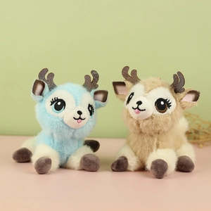 Close-up of blue and khaki plush deer charms with glittery antlers and embroidered eyes