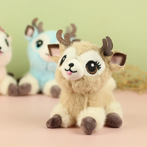 Close-up of cute plush reindeer keychain with sparkling antlers and embroidery