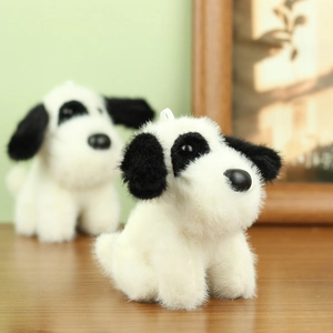 Close-up of soft plush spotted puppy dolls with fluffy texture and cute floppy ears