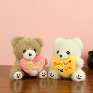 Cute teddy bear plush charms in brown and white with embroidered heart pillows