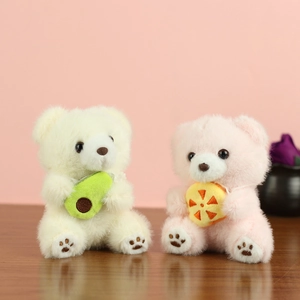 Detail of plush bear pendants featuring cute avocado and orange slice accessories