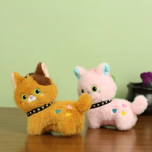 Cute plush cat keychains in orange and pink with studded collars and star embroidery