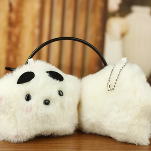 Close-up of a white fluffy plush star keychain with soft faux fur and silver bead chain