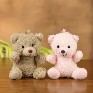 Cute plush teddy bear keychains in brown and pink with soft curly faux fur and bead chain