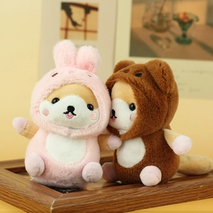 Detailed close-up of cute Shiba Inu plush keychains in rabbit and bear costumes