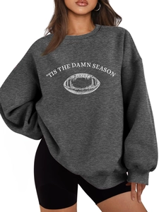Detail of white screen-printed rugby graphic and 'TIS THE DAMN SEASON text on charcoal sweatshirt